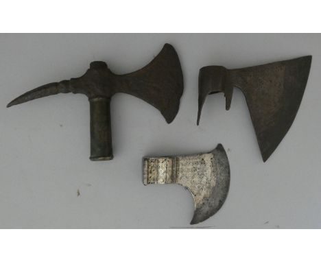 AN INDIAN AXE HEAD, 18TH CENTURY AND TWO FURTHER AXE HEADS, 18TH/19TH CENTURYthe first of triangular section, formed with a c