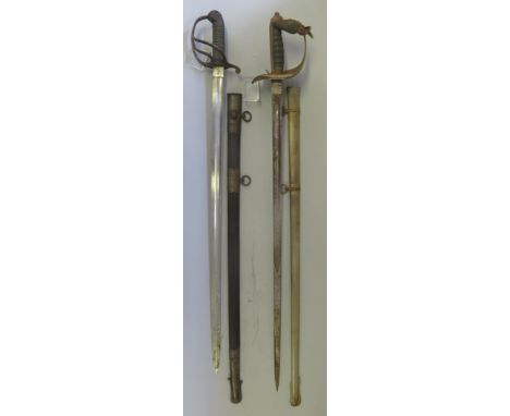 AN EDWARD VII 1897 PATTERN INFANTRY OFFICER~S SWORD AND AN OFFICER~S SWORDof regulation type, the first with etched blade, de