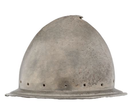AN ITALIAN MORION IN THE ~SPANISH~ FASHION, CIRCA 1580formed in one piece with an almond-shaped crown rising to a short ~stal