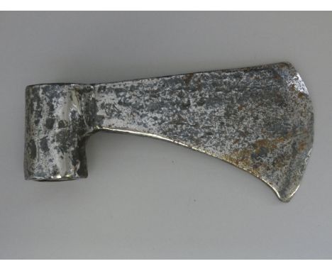 AN IRON AXE-HEAD, 18TH/19TH CENTURYof wedge-section with long curved blade, incised with a cross mark on one face and robust 