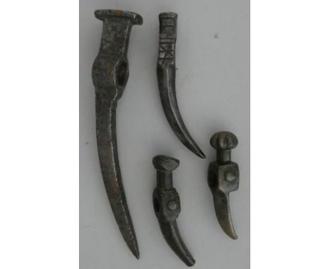 FOUR EAST EUROPEAN WAR HAMMER HEADS, 18TH AND 19TH CENTURIESthe first a Nadziak, in 17th century style, of characteristic for