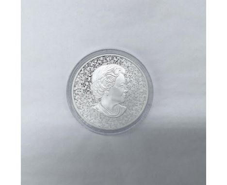 The obverse side features a portrait of Queen Elizabeth II over a pattern of Forget-Me-Not flowers. The reverse side depicts 