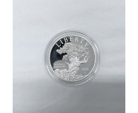Philadelphia Mint. The obverse side depicts a bristlecone pine tree. The reverse side features a young bald eagle standing on