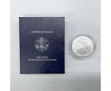 1 ounce. West Point Mint. The obverse side depicts full length figure of Liberty in stride draped in the folds of the flag. S