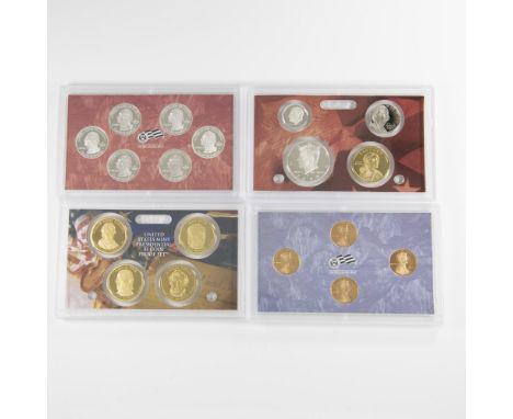 Four US Mint cases. San Francisco Mint. First case contains: Kennedy Half Dollar, Lincoln Penny, Jefferson Nickle, Roosevelt 