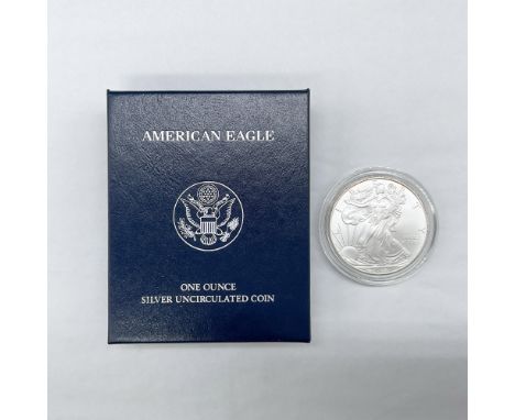 1 ounce. West Point Mint. The obverse side depicts full length figure of Liberty in stride draped in the folds of the flag. S