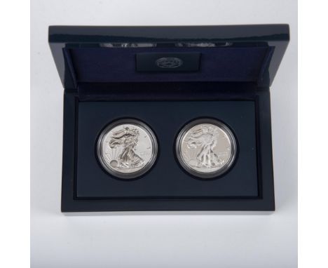 A Reverse Proof and a Enhanced Uncirculated Silver Dollar. West Point Mint. The obverse side depicts full length figure of Li