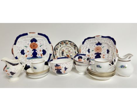 A 19th century part tea service in blue and red with purple gilt decoration of Gaudy Dutch style comprising, a milk jug, a su