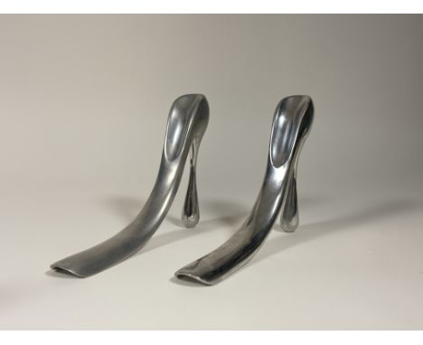 A pair of cast aluminium stiletto shoe horns designed by Manolo Blahnik, marked verso. (l-26cm h-20cm) (2)