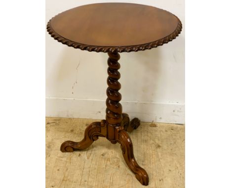 A mahogany occasional table, with a circular top on a barley twist column and tripod base, 75cm high