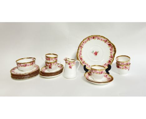 A Royal Doulton tea set in 'Baby Rose' comprising, six side plates, six tea cups, a large sugar bowl, six saucers, a serving 