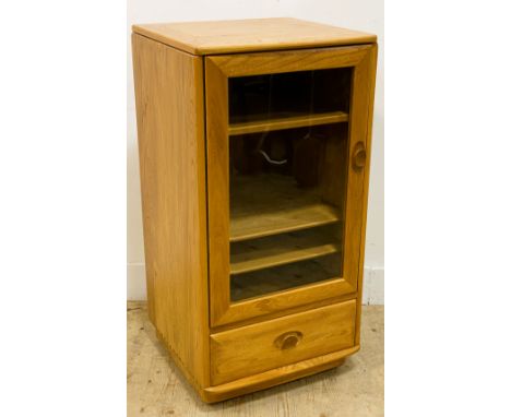 An Ercol elm Hi-Fi cabinet, with a lift up lid above a glass door enclosing shelves above a drawer, 98.5cm x 50cm x 48cm 