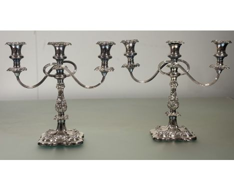 A pair of late 19thc / early 20thc Sheffield plated three-branch candelabra complete with removable drip trays on baluster ch