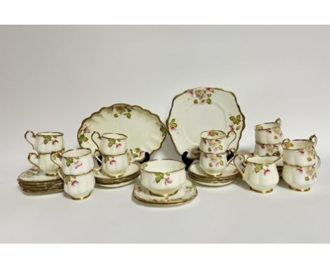 A 1920/30s Royal Albert 'Christmas Rose' tea service decorated with gilt edges and floral and leaf decoration comprising, a c