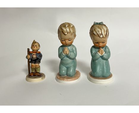 A collection of three Goebel Hummel figures comprising, A Child's Prayer, kneeling boy and girl figure (h.13cm), together wit