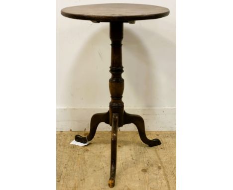 A Georgian mahogany wine table, with a circular snap top on a turned column and tripod base, 70cm x 45cm 