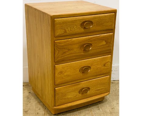 An Ercol elm bedside chest, with four drawers standing on a plinth base, 69cm x 47cm 44cm 
