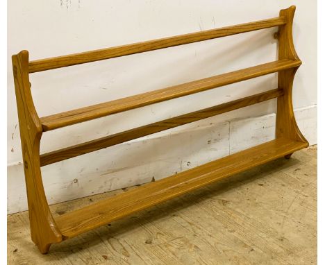 An Ercol wall mounted plate rack, with two shelves with shaped side supports, 50cm x 96.5cm 