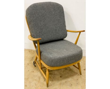 An Ercol blonde beech Windsor armchair, with a loose back and seat cushion, 87cm high