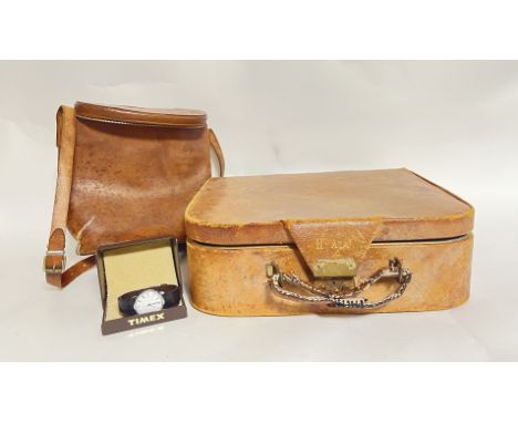 A leather travel vanity suitcase complete with fitted interior and inscribed 'H.A.0' to latch, complete with various pockets 
