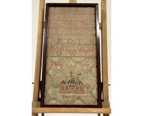A 19thc needwork sampler by Mary Reid dated 1887, with house and urn enclosed within a tulip border, with alaphabet and numbe