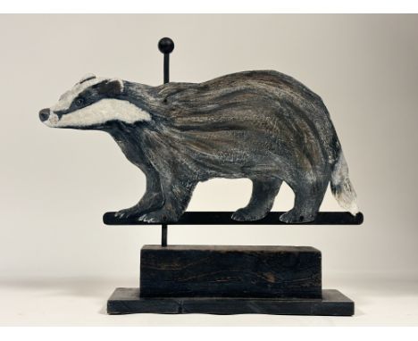 A Ramsay Gillies contemporary Folk Art inspired weather vane with painted sheet metal of a badger, raised on a wooden stepped