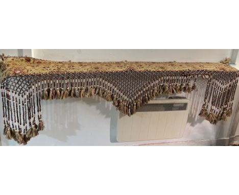 A decorative carpet wall hanging with purple beads in diamond form with diamond mirror detailing to the main body (l. 194cm)