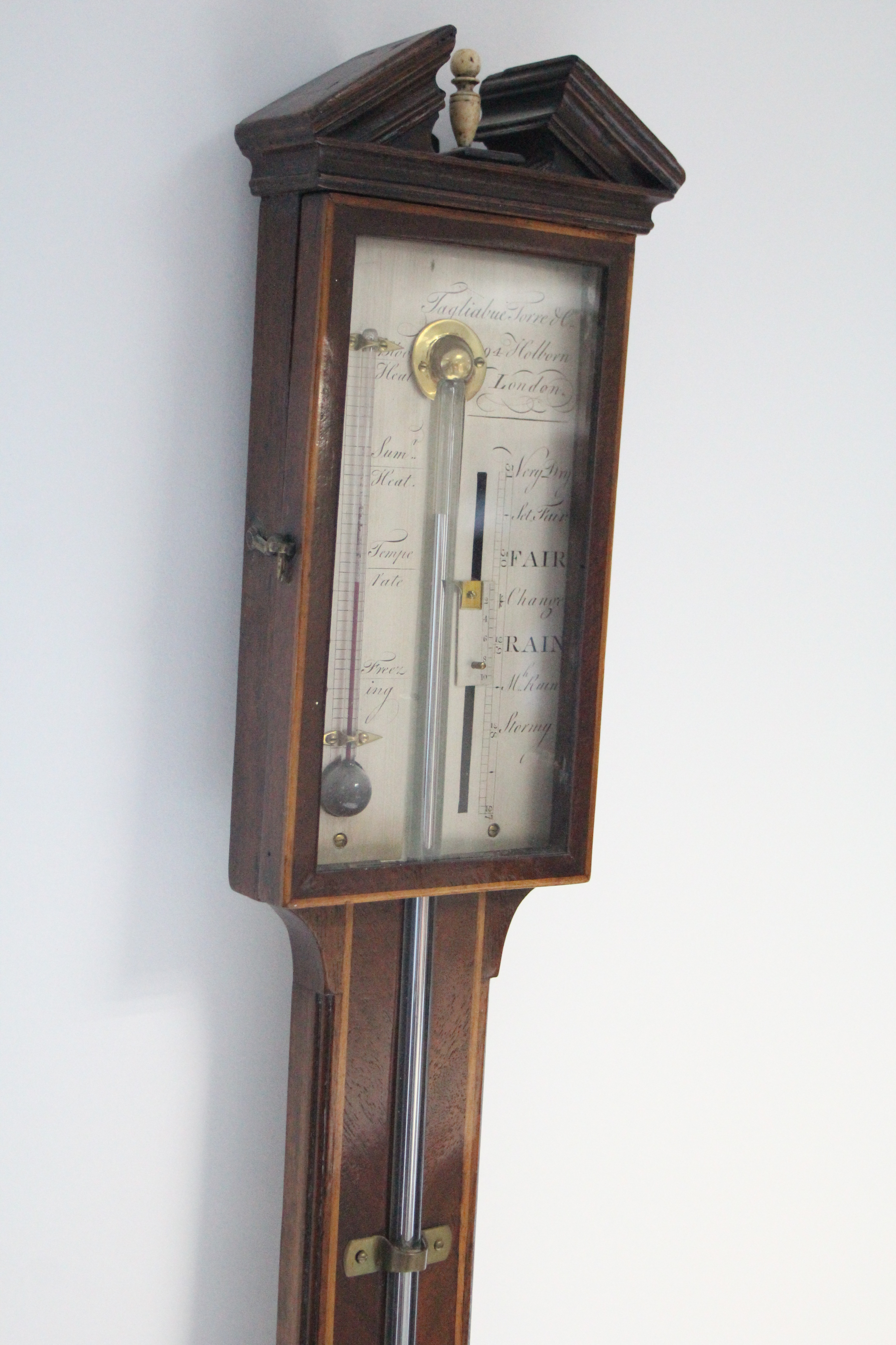 A III stick barometer, the engraved silvered dial with Vernier