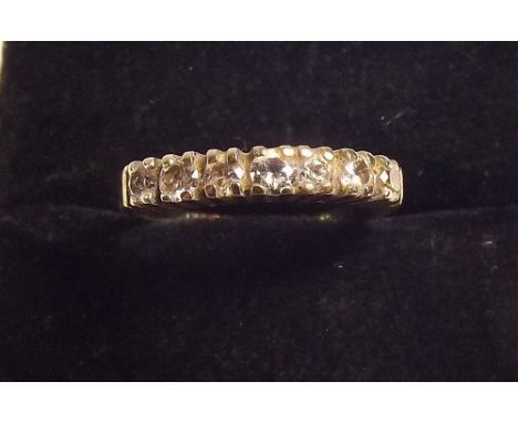 An 18ct gold seven stone diamond ring 