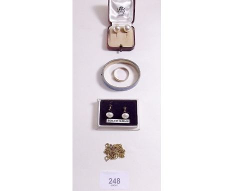 A 9 carat gold scarf ring 3.5g, a pair of gold earrings, a pair of silver earrings, silver bracelet and two yellow metal neck