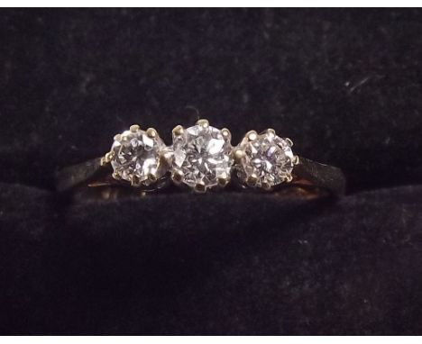 A 9ct gold ring set three diamonds 