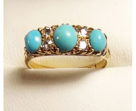 A Victorian 18ct gold ring set three turquoise and four diamonds 