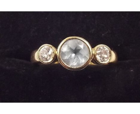 An 18ct gold aquamarine and diamond ring