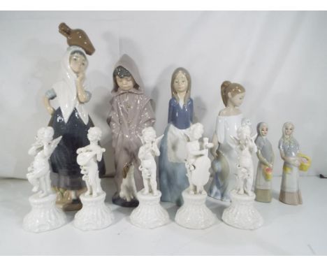 Four Nao figurines and two similar the largest being 31.5cms (h) also included in the lot are five ceramic figurines depictin