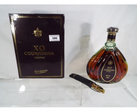 Courvoisier X.O. Cognac, 40% vol, 0,70 litre in original carton with free gilt butler's knife in sheath, ca 1988 - Est £40 - 