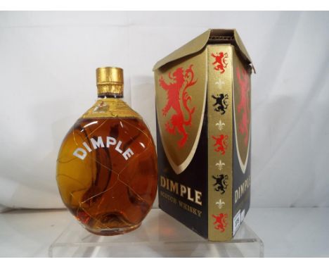 A bottle of Haig Dimple Scotch Whisky c. late 1950's / 1960's, wire mesh around bottle, 70 proof, level low shoulder in origi