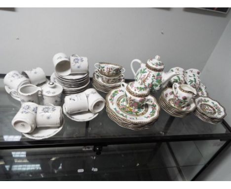 A Coalport ceramic tea service containing 44 pieces decorated in the Indian Tree pattern, three small unopened boxes and a Mi