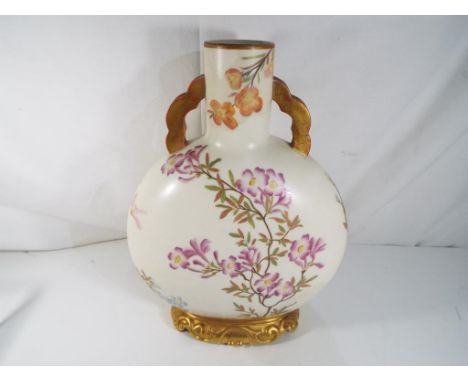 Royal Worcester - a Royal Worcester Moon Flask having twin handles hand painted floral decoration with gilded detail, approx 