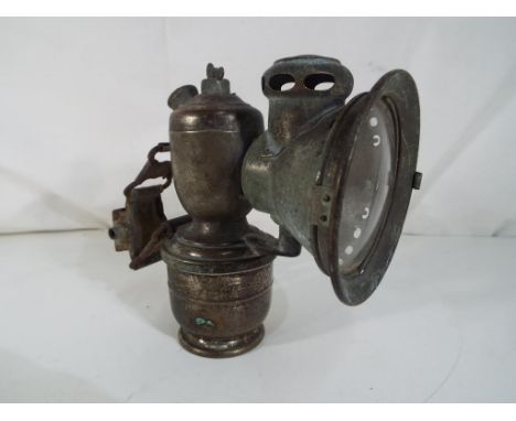 A Lucus carbide motorbike lamp, 14 cm (h)