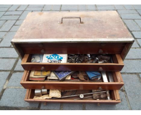 A wooden tool chest containing 5 internal drawers comprising a quantity of vintage tools and similar 