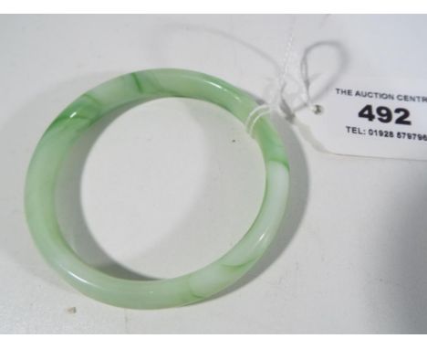 A jade bangle Est £30 - £50