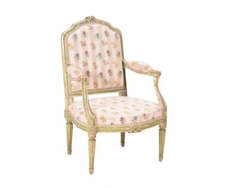 AN EARLY LOUIS XVI GREY AND GREEN PAINTED FAUTEUIL CIRCA 1775 With arched padded back, the moulded frame with flowerhead cres