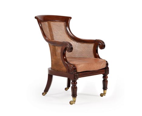 A REGENCY MAHOGANY LIBRARY ARMCHAIRIN THE MANNER OF GILLOWS, CIRCA 1820With canework back and seat and squab seat, on lappet 