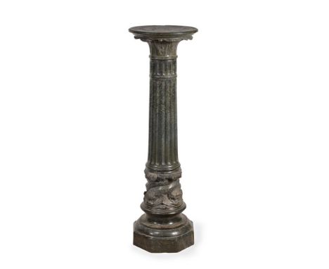 AN ITALIAN SERPENTINE MARBLE COLUMN 19TH CENTURYWith revolving top, dolphin carved band to base,113cm high, the top 34cm diam