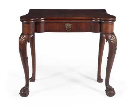 A GEORGE II MAHOGANY FOLDING CARD TABLE POSSIBLY IRISH, CIRCA 1750 The hinged and shaped top opening to a baize inset playing