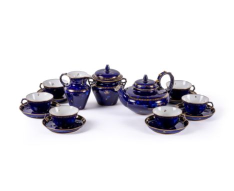 A SEVRES PORCELAIN BLEU LAPIS GROUND AND GILT TEA SERVICE IN THE SECOND EMPIRE STYLEMID 20TH CENTURYWith original factory bro