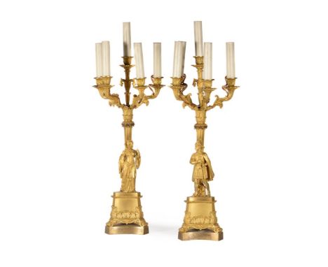 A PAIR OF GILT METAL FIVE-LIGHT CANDELABRASECOND HALF 19TH CENTURYWith scrolling branches above pair of Renaissance style man
