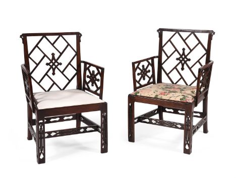 A PAIR OF GEORGE III MAHOGANY COCKPEN ARMCHAIRS IN THE CHINESE CHIPPENDALE MANNER, CIRCA 1770each 96cm high, 63cm wide, 59cm 