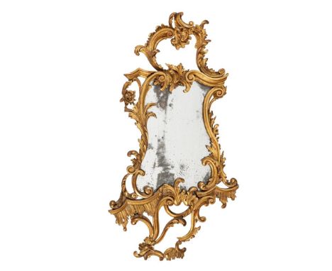 A CARVED GILTWOOD WALL MIRROR IN GEORGE III STYLE, IN THE MANNER OF THOMAS CHIPPENDALE, 19TH CENTURY 119cm high, 61cm wide