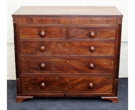 An early 19th century mahogany, boxwood strung chest, the rectangular crossbanded top over two short and three long drawers w